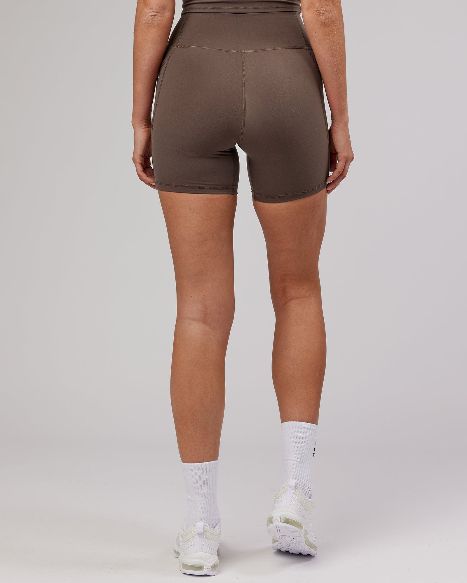 Model wearing Energise Mid Short Tight - Mocha