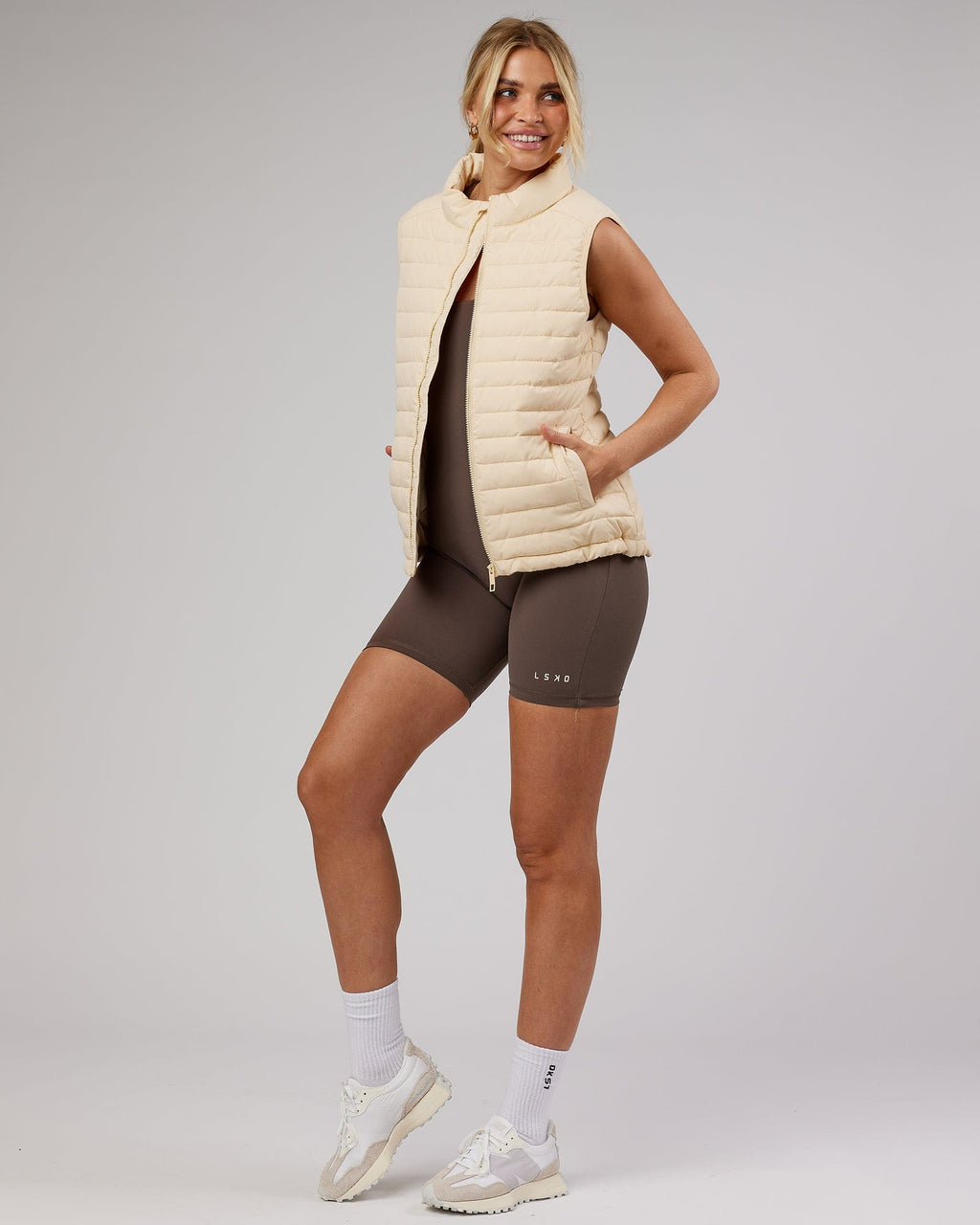 Model wearing Uplift Puffer Vest - Classic Cream