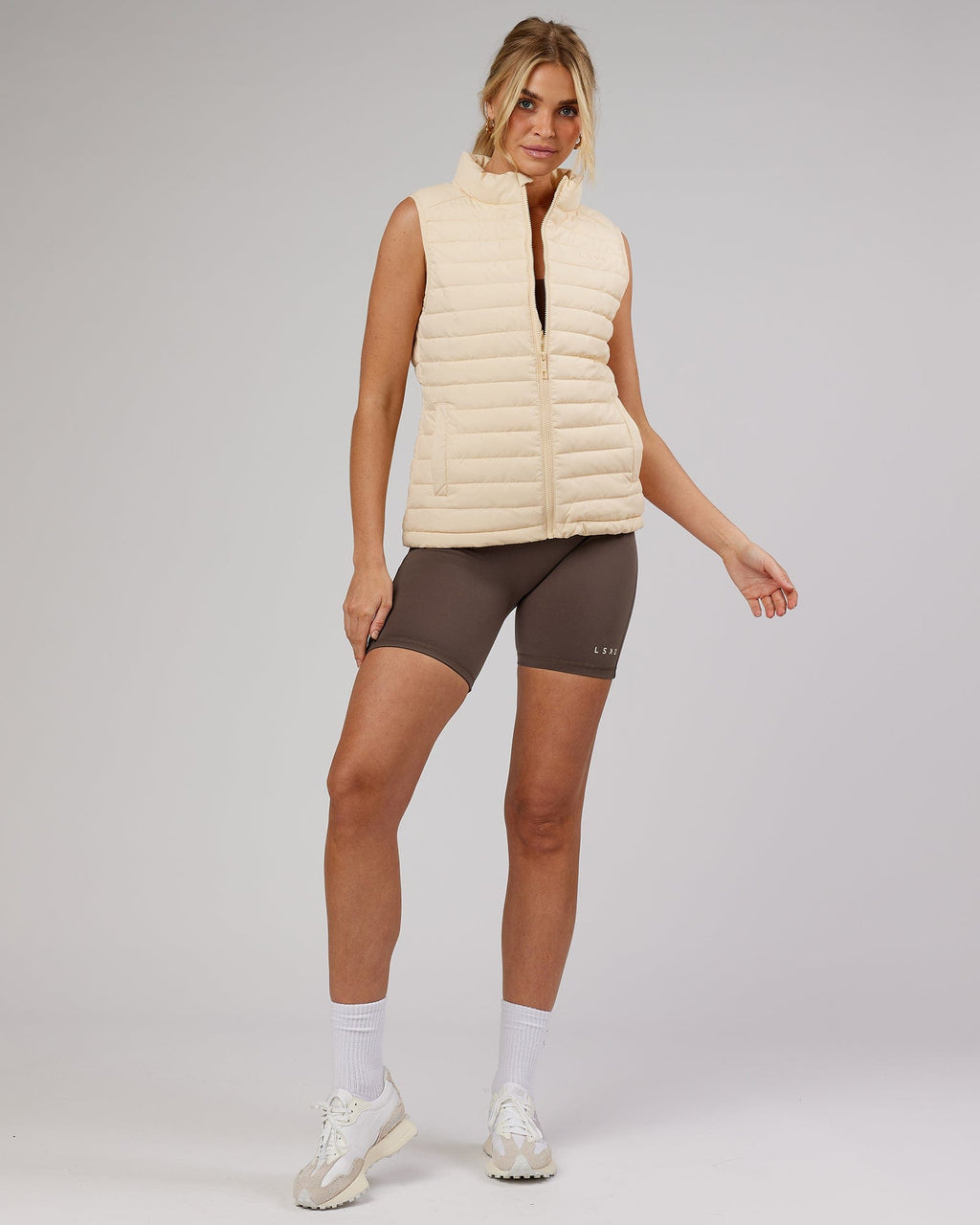 Model wearing Uplift Puffer Vest - Classic Cream