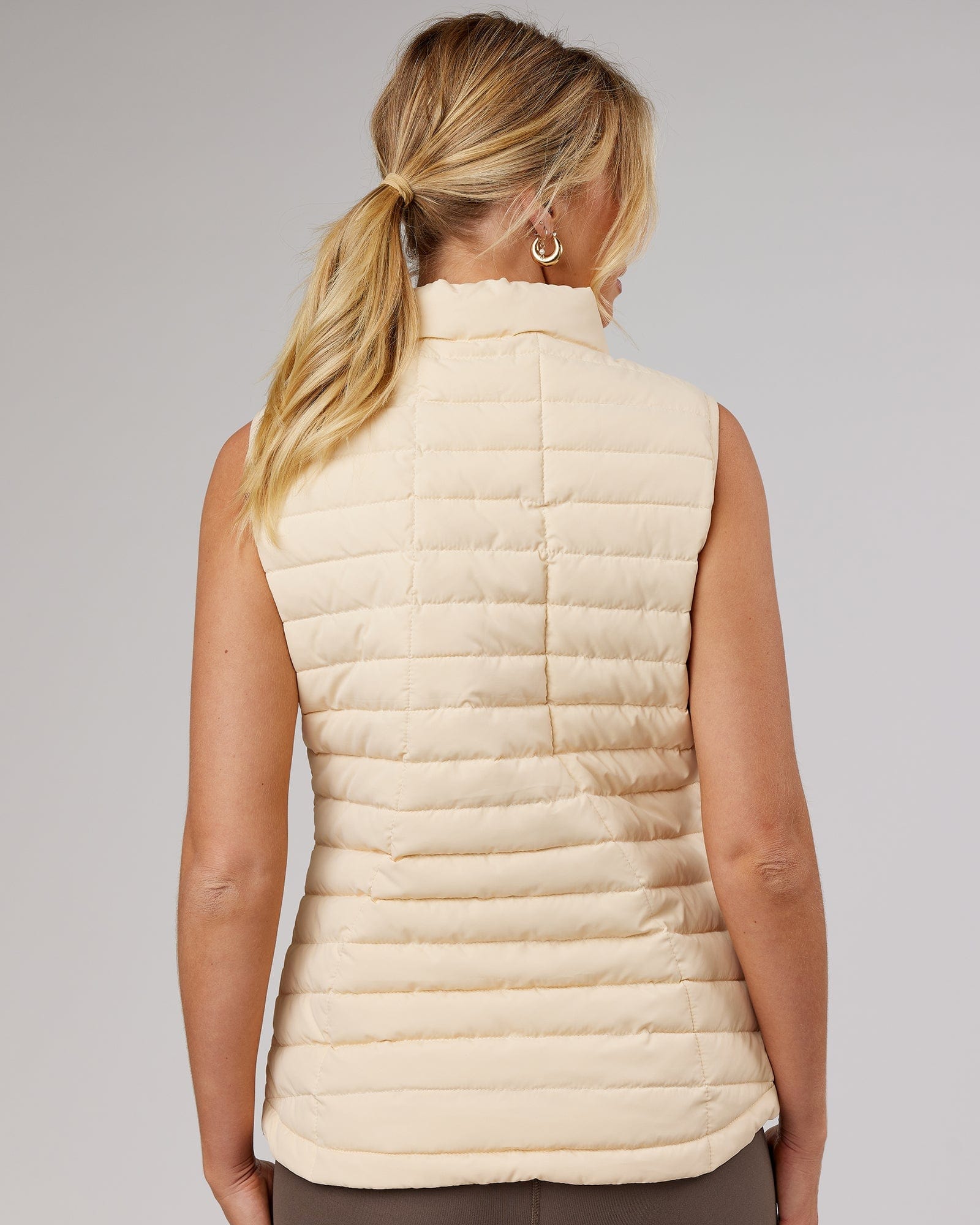 Model wearing Uplift Puffer Vest - Classic Cream