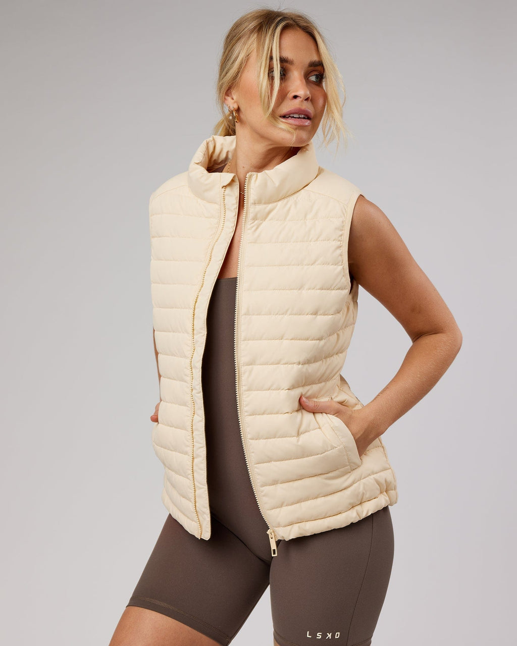 Model wearing Uplift Puffer Vest - Classic Cream