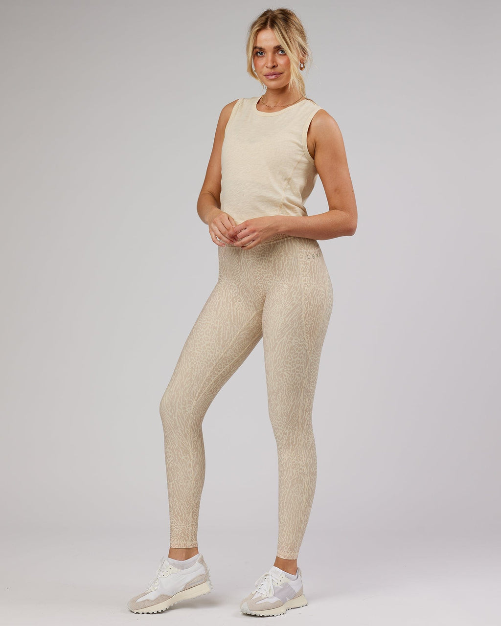 Model wearing Elevate Training Tank - Classic Cream