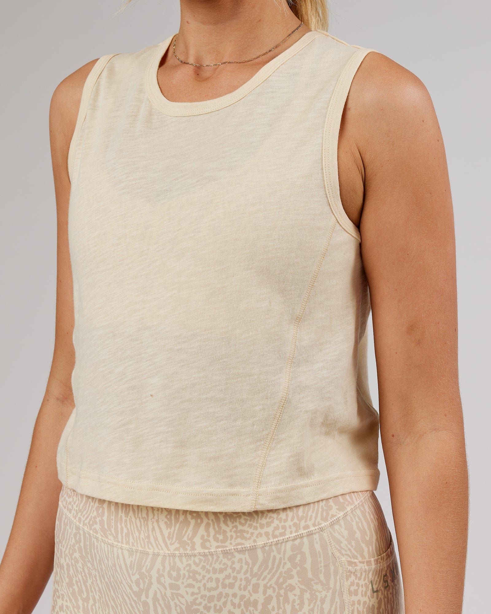 Model wearing Elevate Training Tank - Classic Cream
