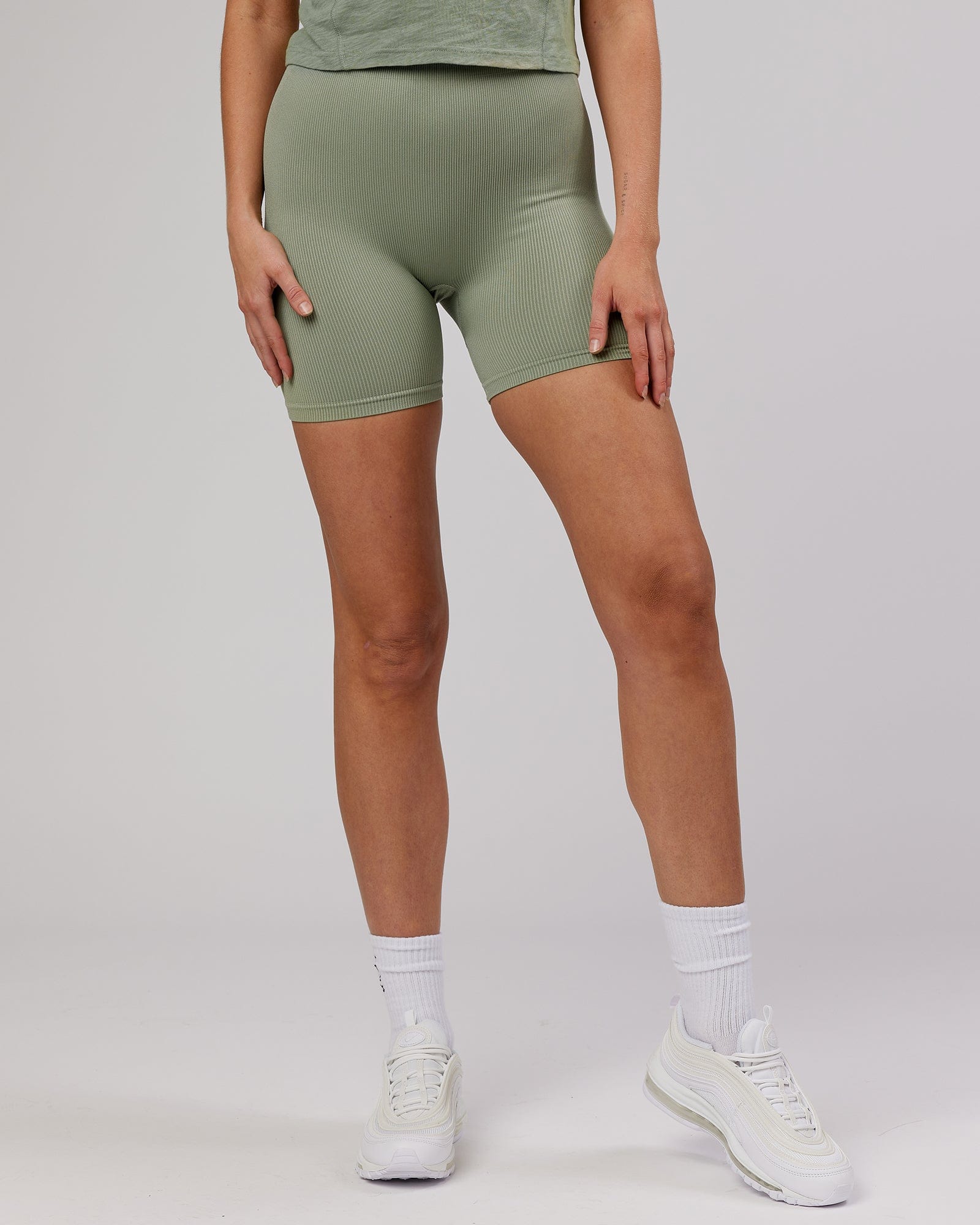 Model wearing Street Seamless Ribbed Mid Short Tight - Sage