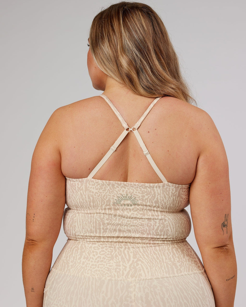 Model wearing Determined Shelf Sports Tank - Rise Print