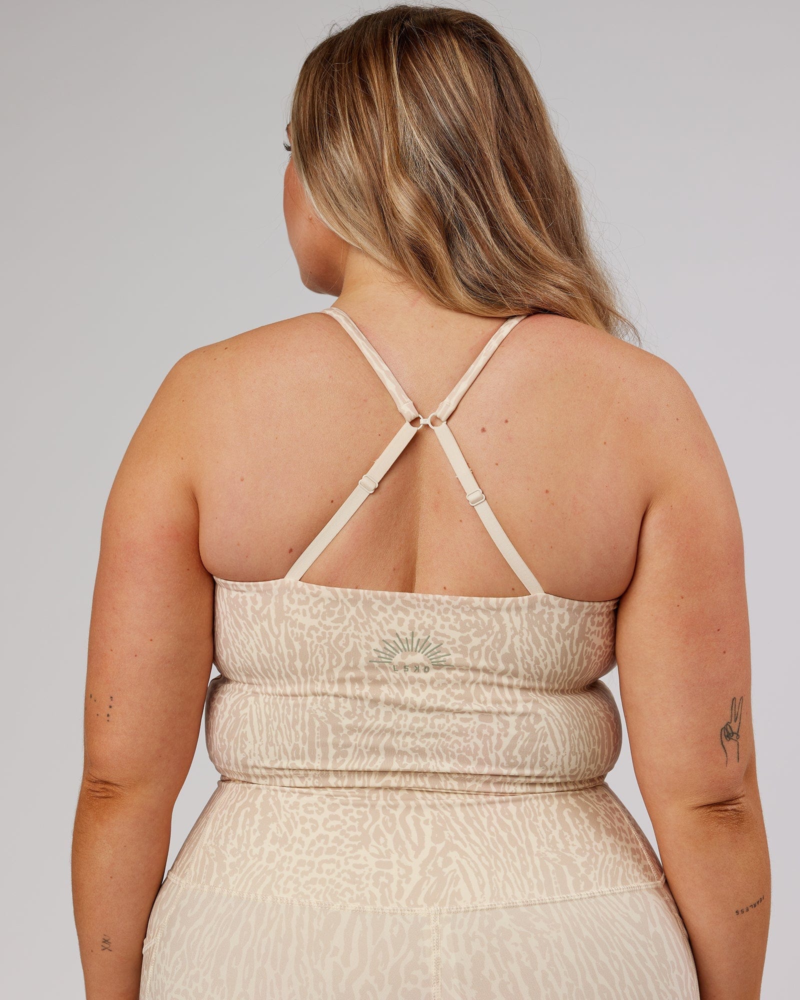 Model wearing Determined Shelf Sports Tank - Rise Print