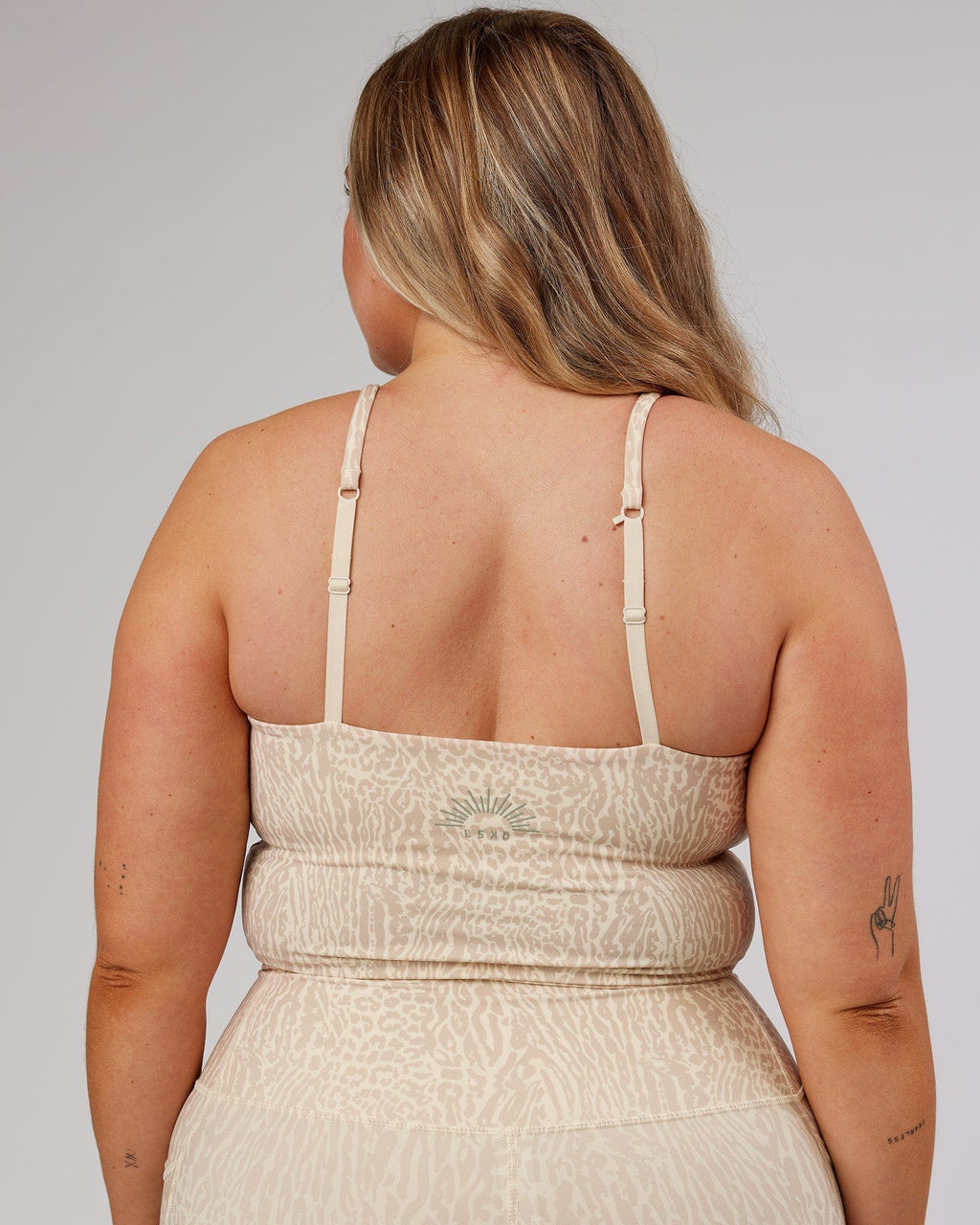 Model wearing Determined Shelf Sports Tank - Rise Print