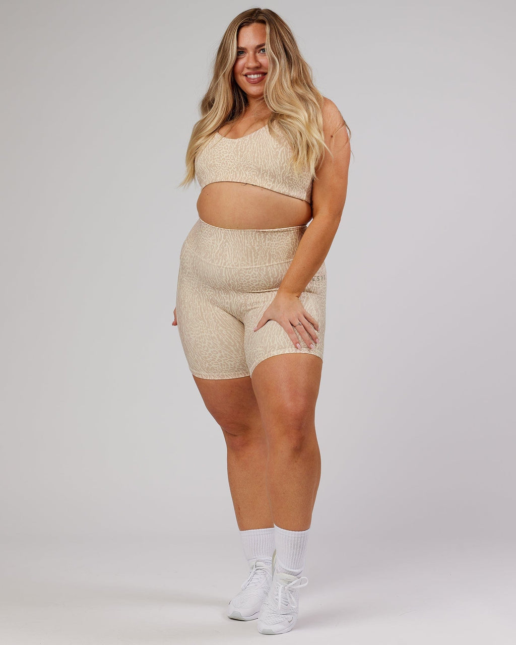 Model wearing Uplift Recycled Sports Bra - Rise Print