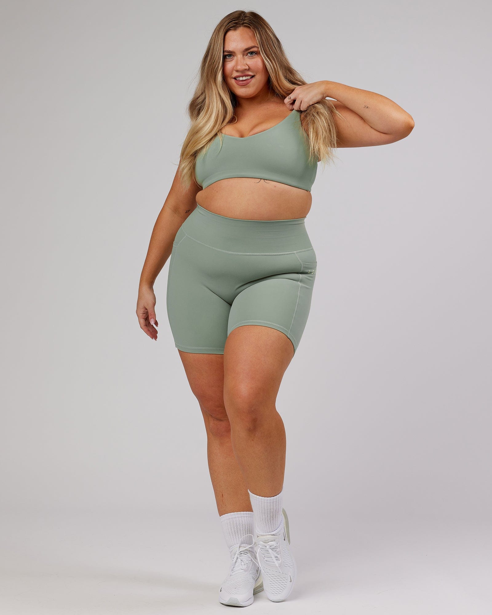 Model wearing Uplift Recycled Sports Bra - Sage