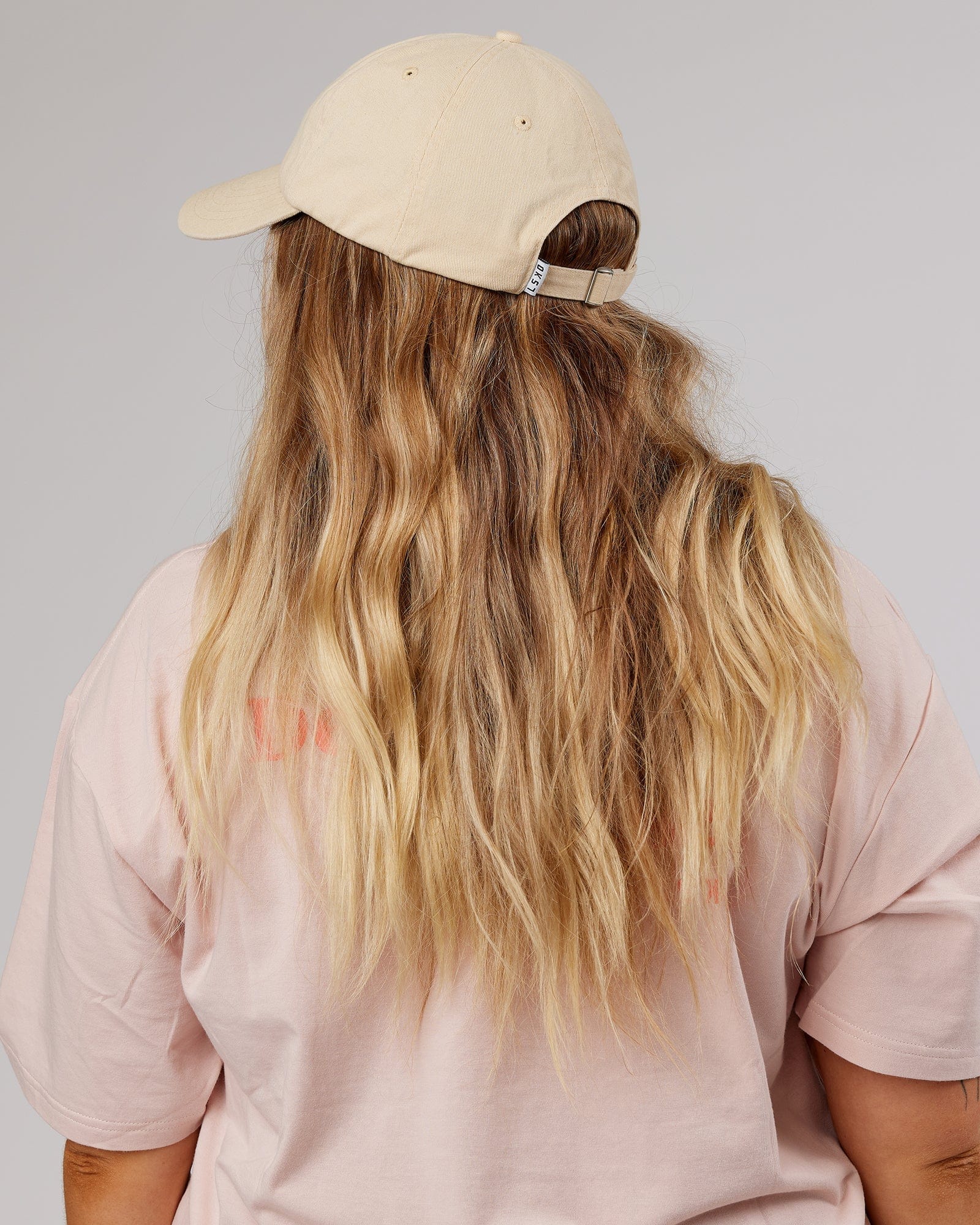 Model wearing Rise Cap - Classic Cream