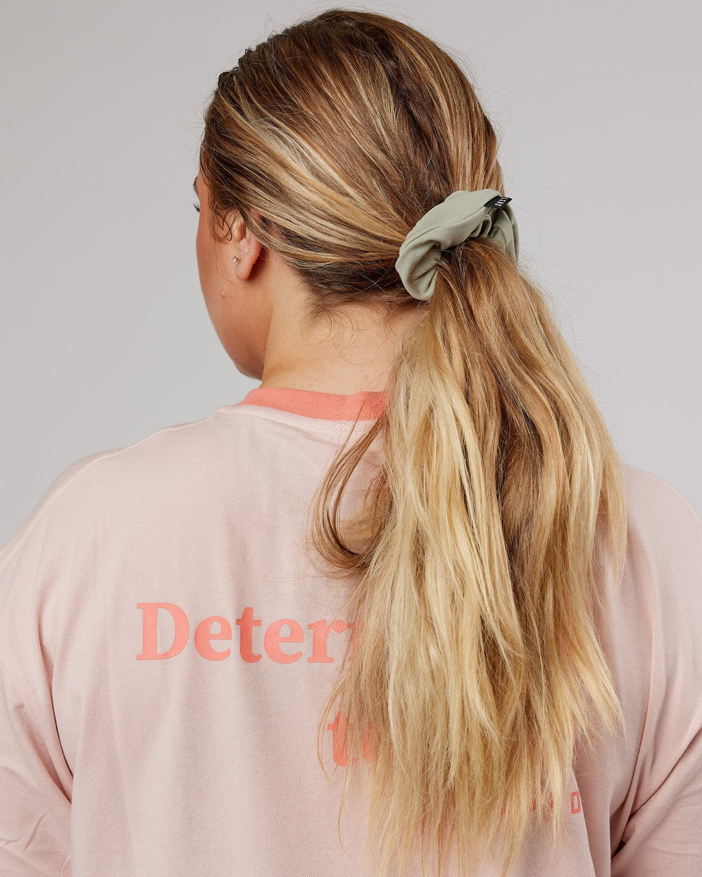 Model wearing Elevate Scrunchie - Sage