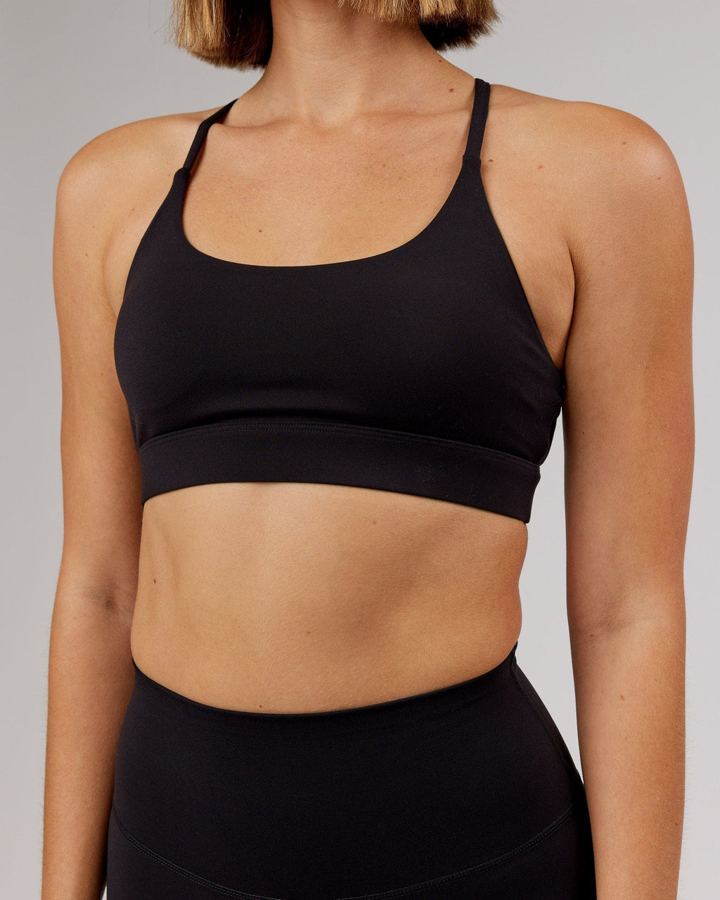 Model wearing Elixir Sports Bra - Black
