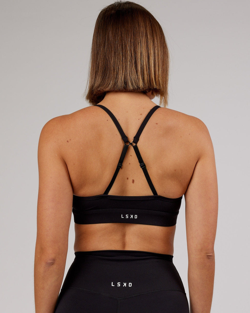 Model wearing Elixir Sports Bra - Black