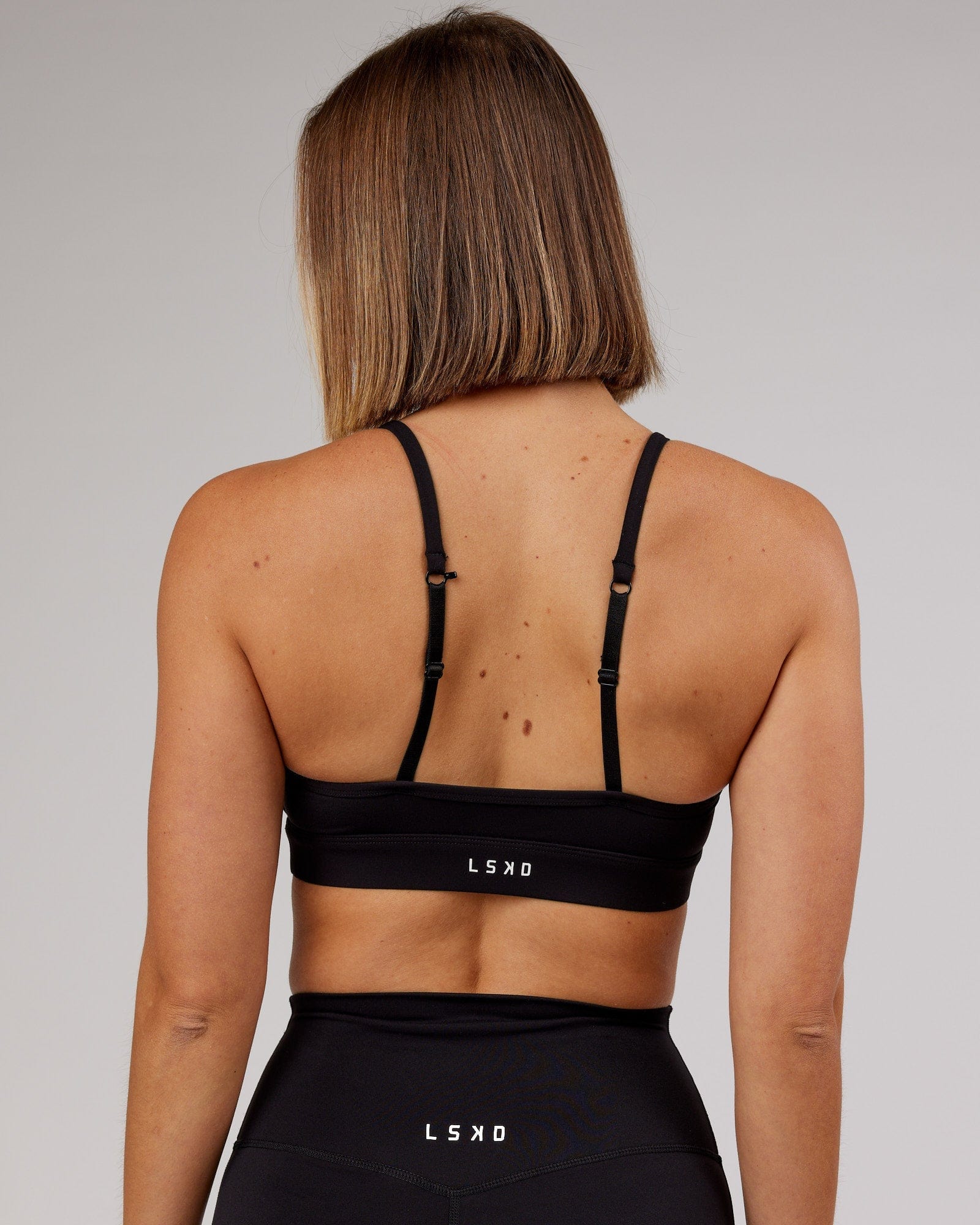 Model wearing Elixir Sports Bra - Black