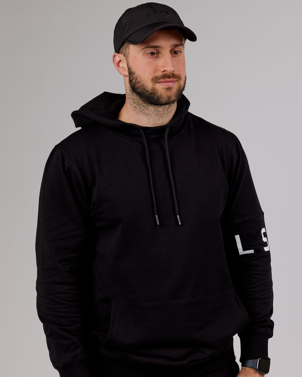 Model wearing Performance Tech Cap - Black