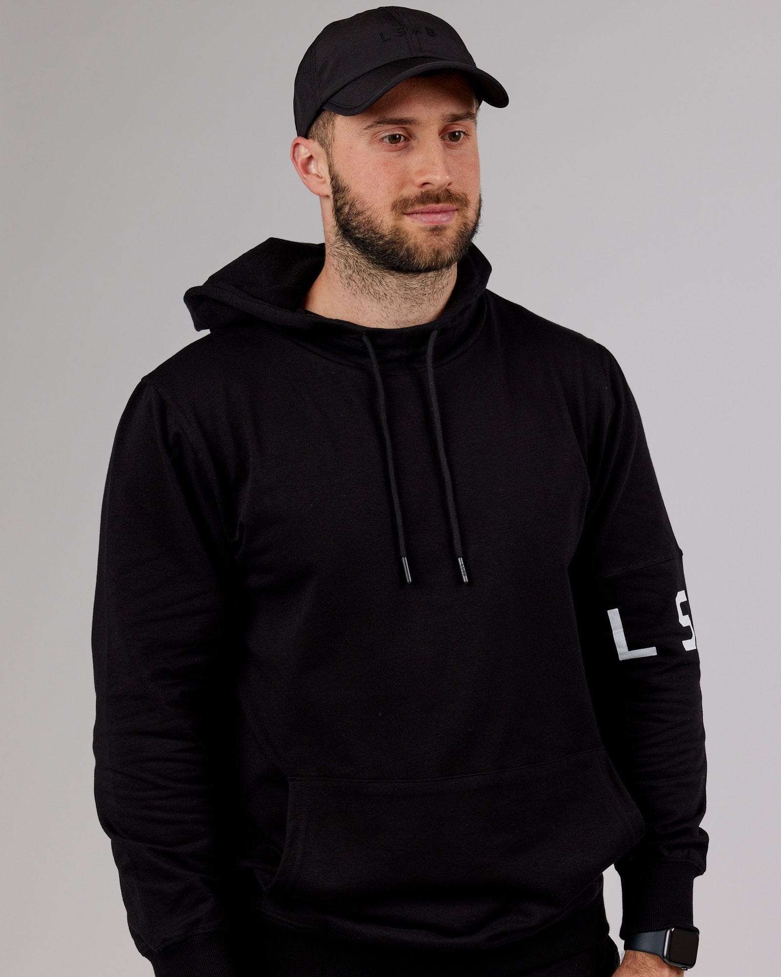 Model wearing Performance Tech Cap - Black