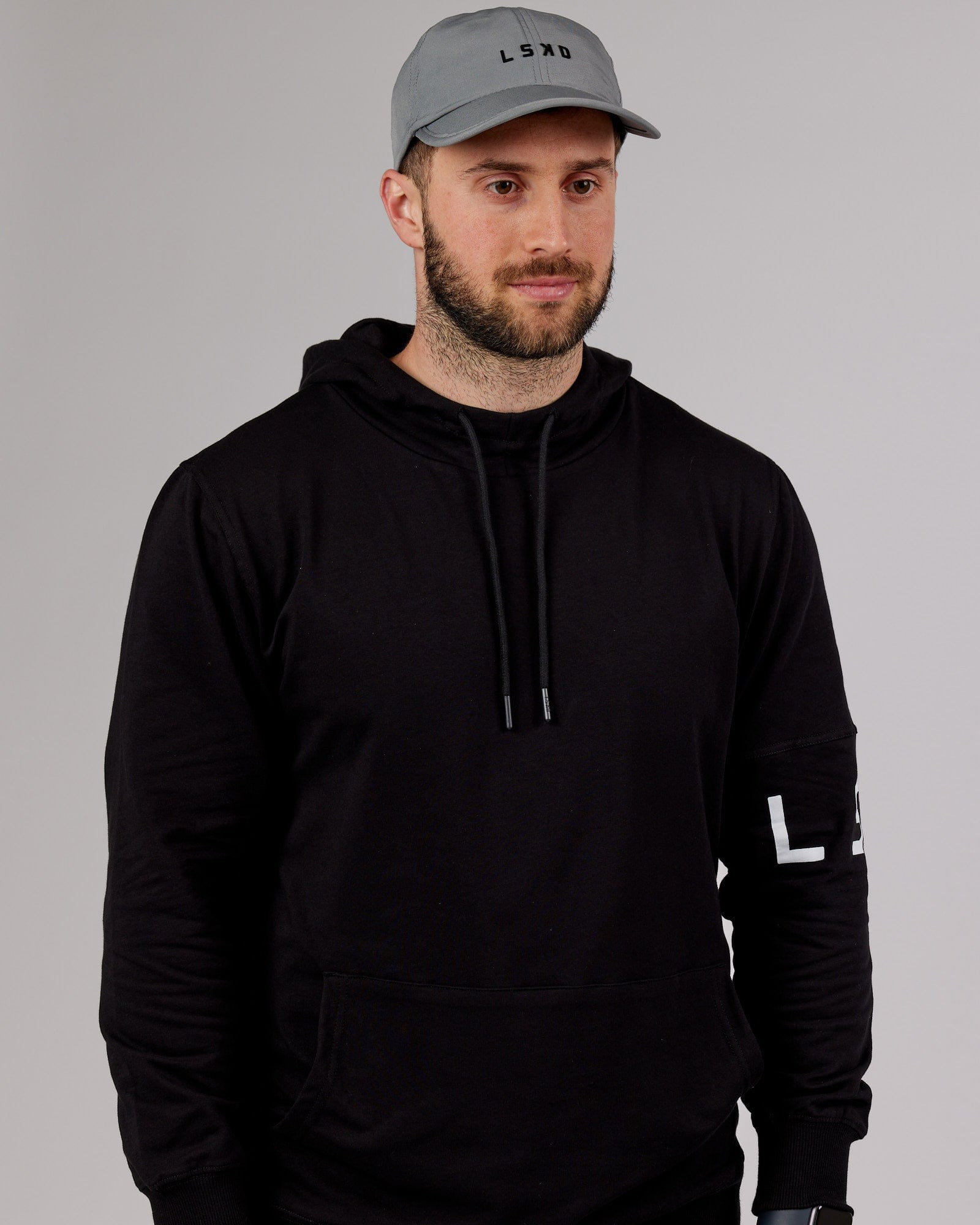 Model wearing Performance Tech Cap - Alloy