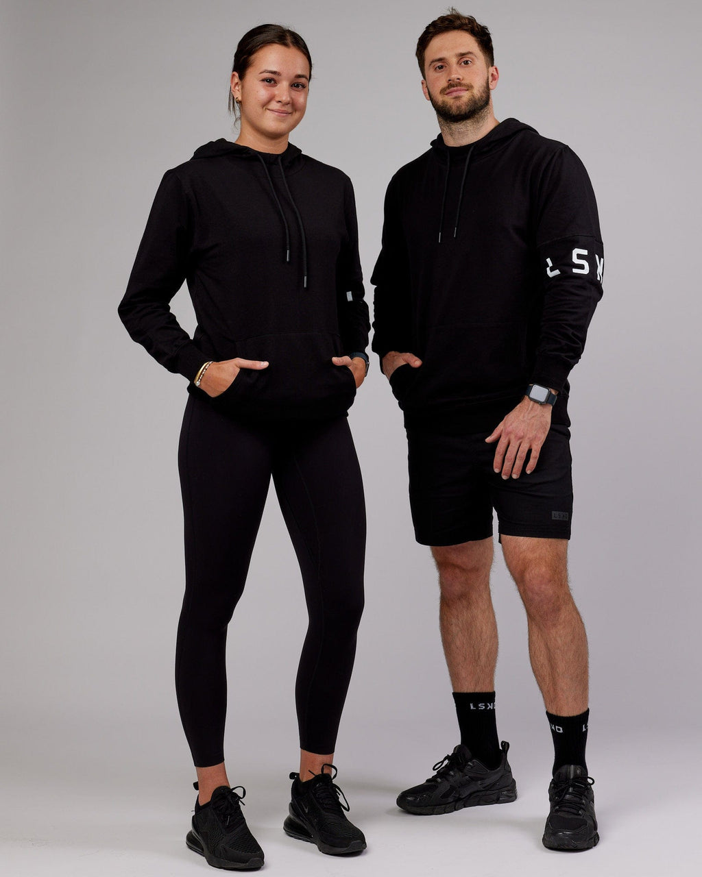 Model wearing Unisex Perimeter FLXFleece Hoodie - Black