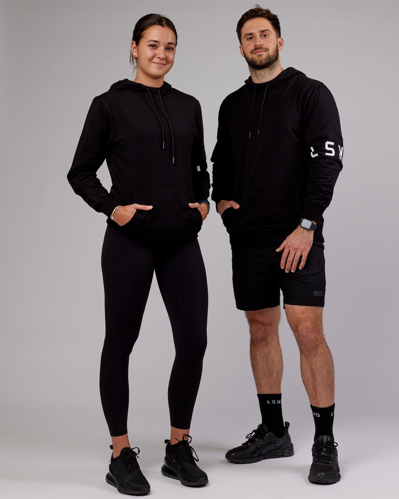 Model wearing Unisex Perimeter FLXFleece Hoodie - Black