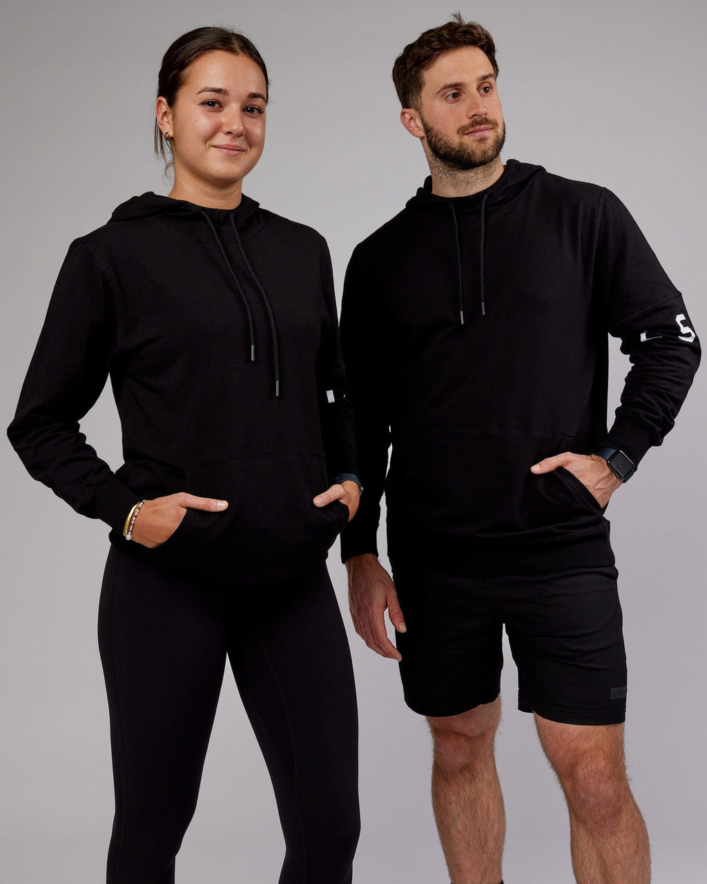 Model wearing Unisex Perimeter FLXFleece Hoodie - Black