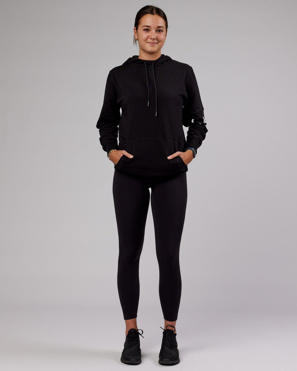 Model wearing Unisex Perimeter FLXFleece Hoodie - Black