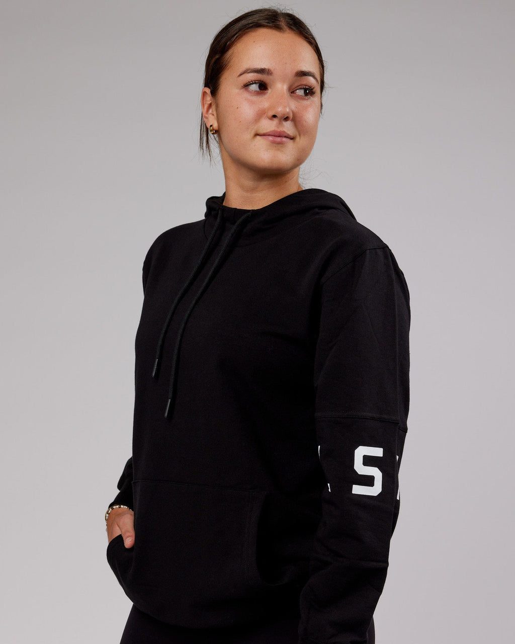 Model wearing Unisex Perimeter FLXFleece Hoodie - Black