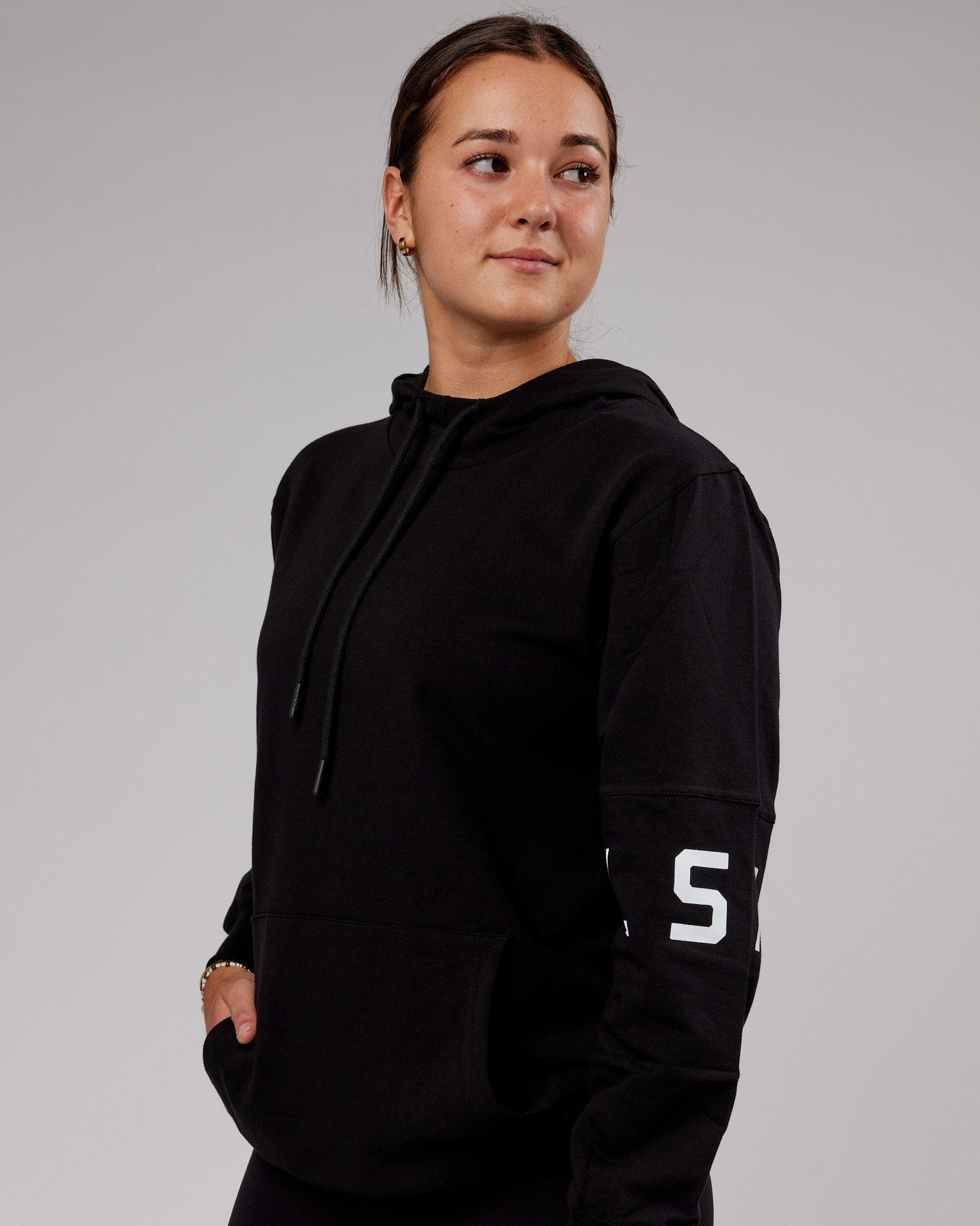 Model wearing Unisex Perimeter FLXFleece Hoodie - Black