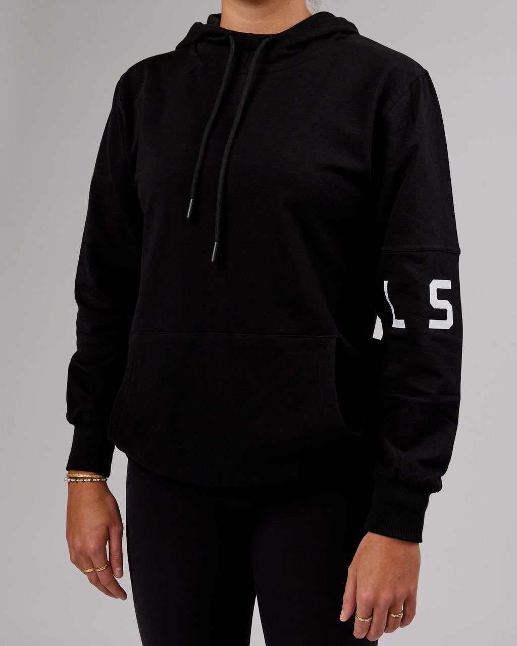 Model wearing Unisex Perimeter FLXFleece Hoodie - Black