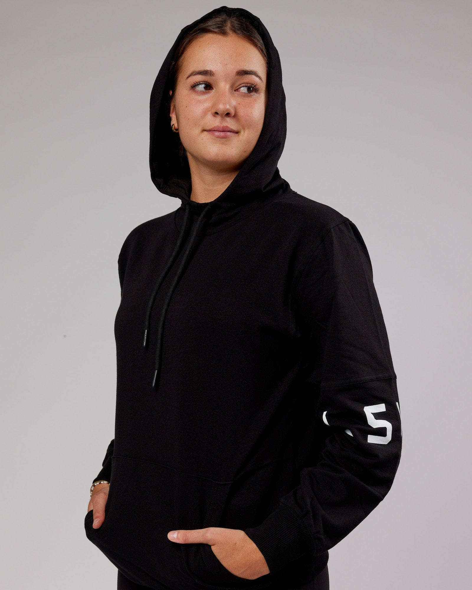 Model wearing Unisex Perimeter FLXFleece Hoodie - Black