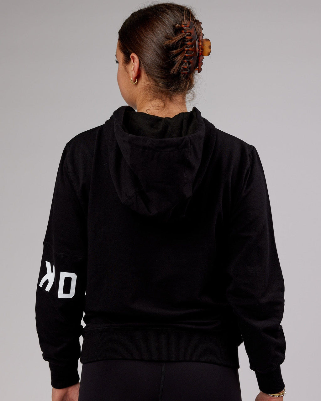 Model wearing Unisex Perimeter FLXFleece Hoodie - Black