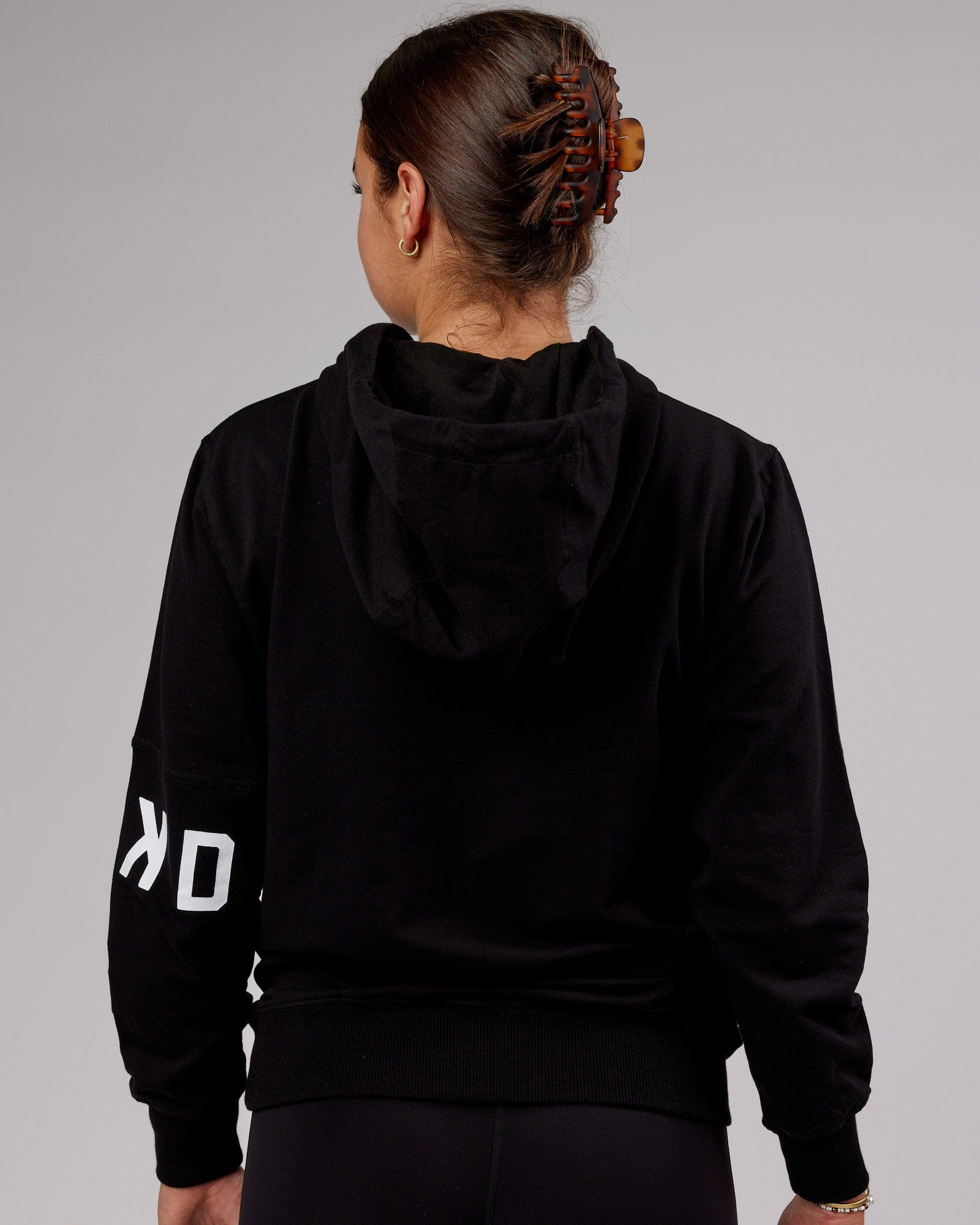 Model wearing Unisex Perimeter FLXFleece Hoodie - Black
