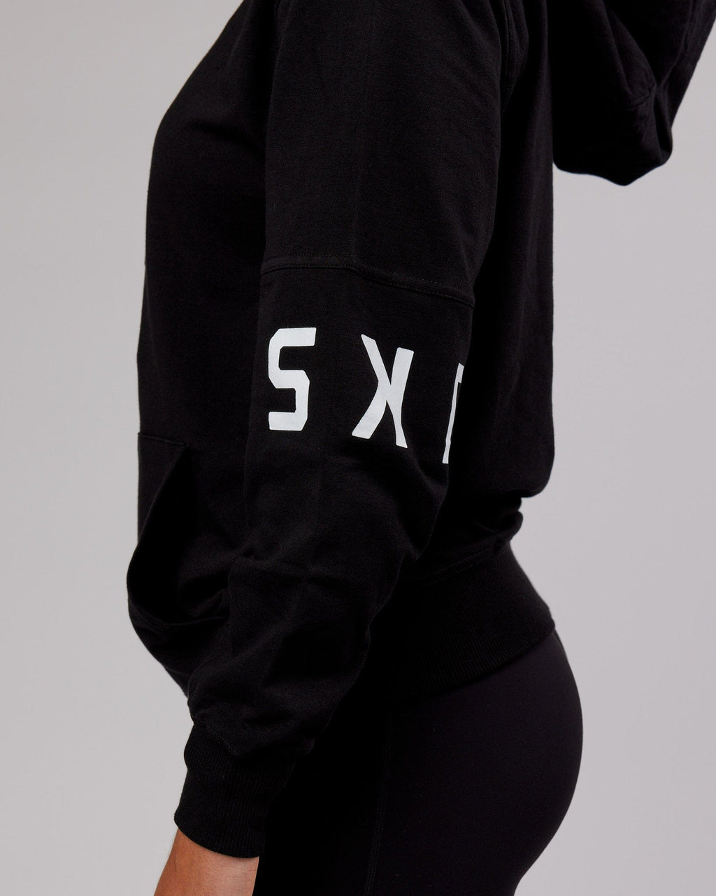 Model wearing Unisex Perimeter FLXFleece Hoodie - Black