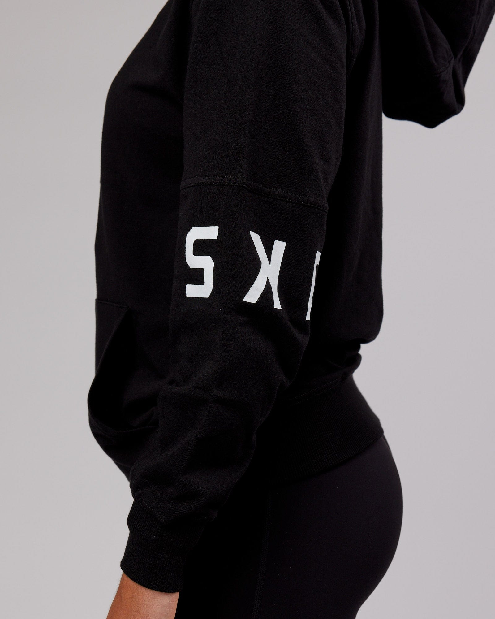 Model wearing Unisex Perimeter FLXFleece Hoodie - Black