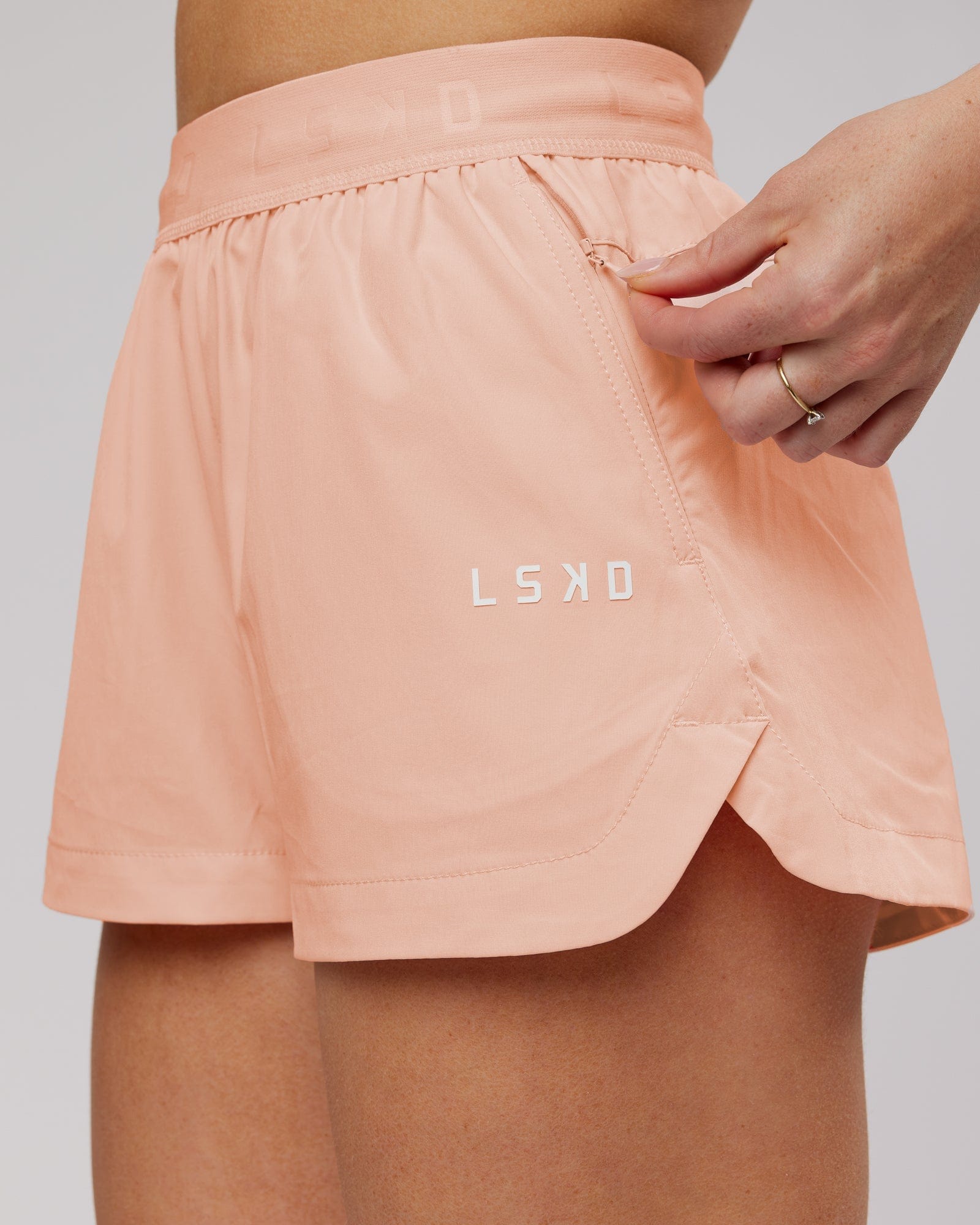 Model wearing Competition Linerless Performance Short - Pink