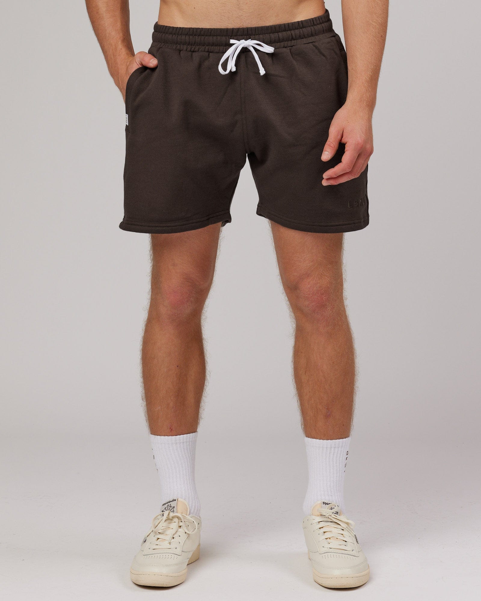 Model wearing Rise Track Short - Mocha