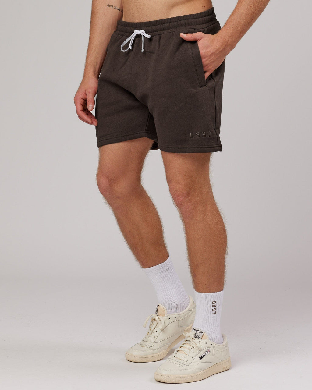 Model wearing Rise Track Short - Mocha
