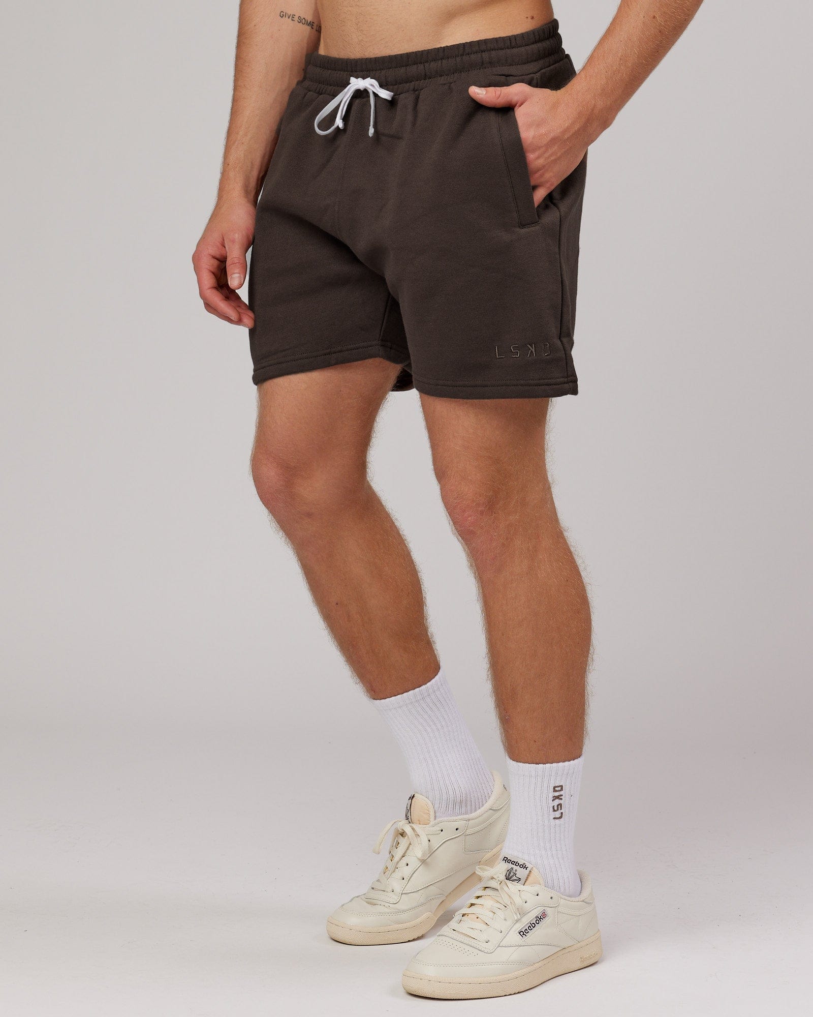 Model wearing Rise Track Short - Mocha