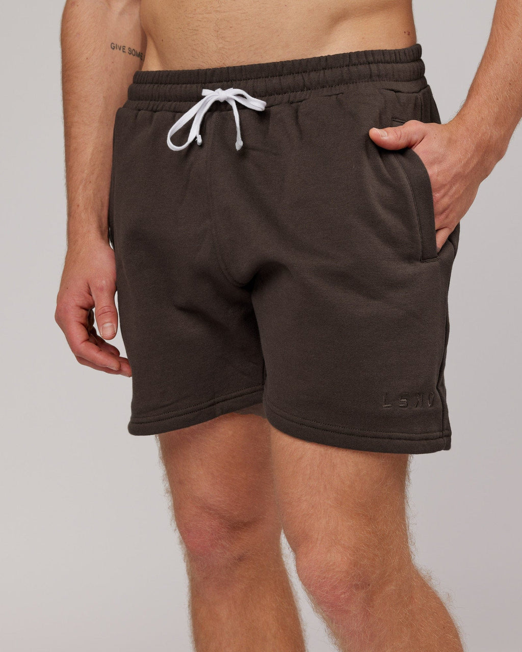 Model wearing Rise Track Short - Mocha