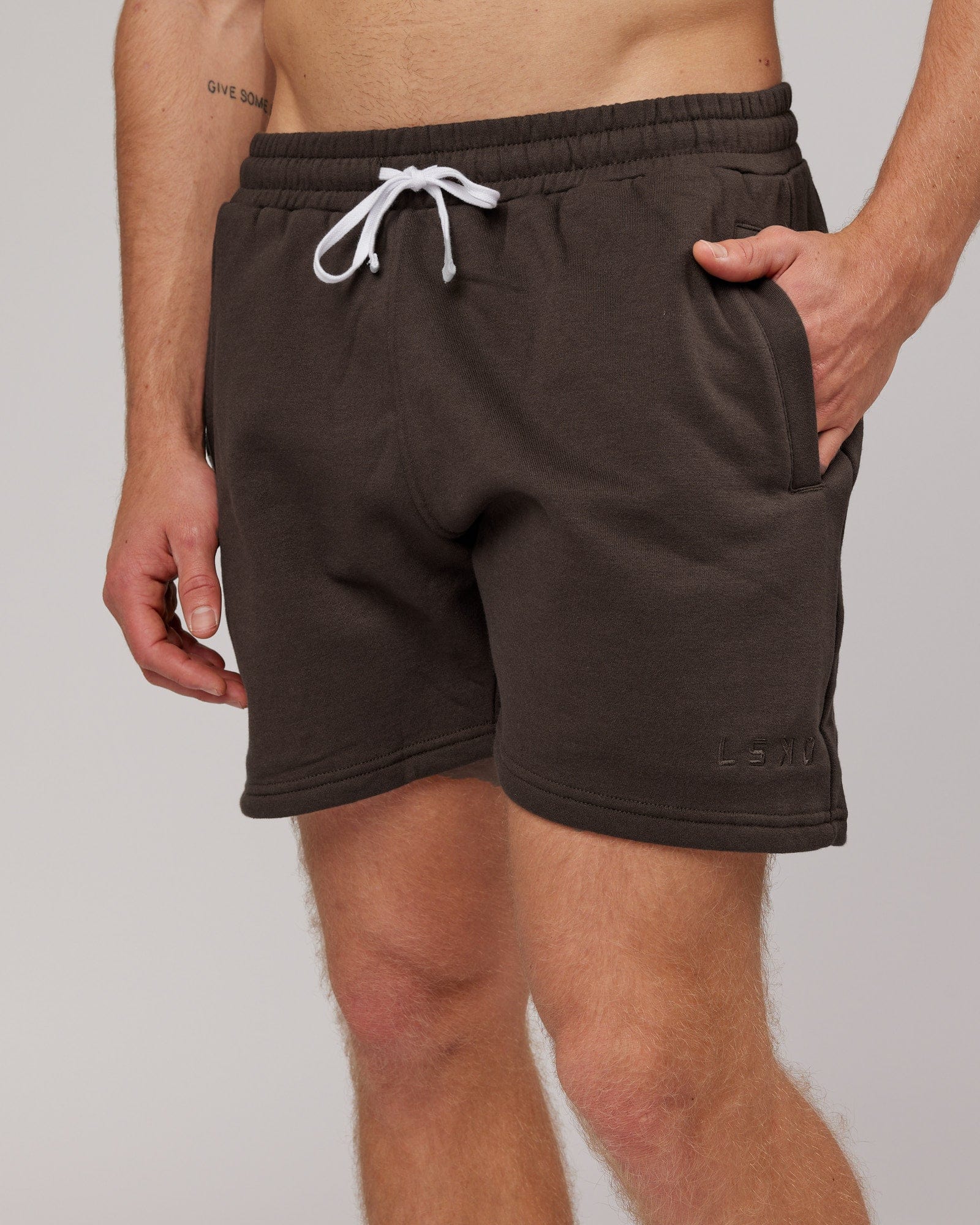 Model wearing Rise Track Short - Mocha