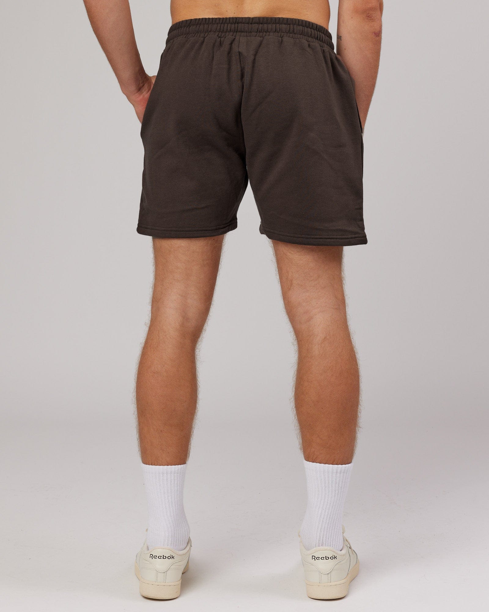 Model wearing Rise Track Short - Mocha