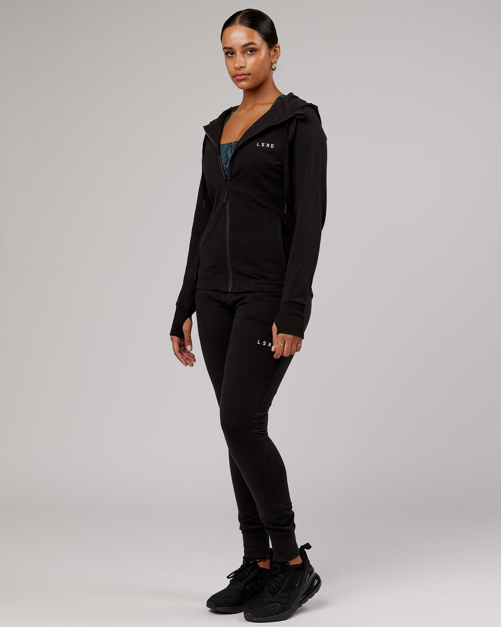 Model wearing PB Zip Through Hoodie - Black-Tonal