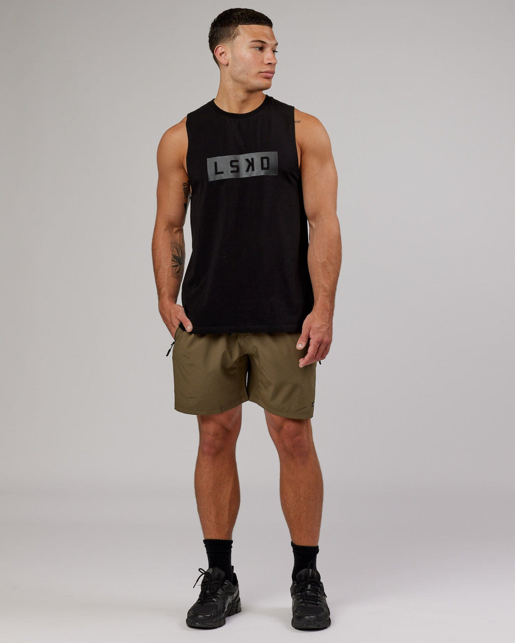 Model wearing Rep 7'' Performance Short - Army Green