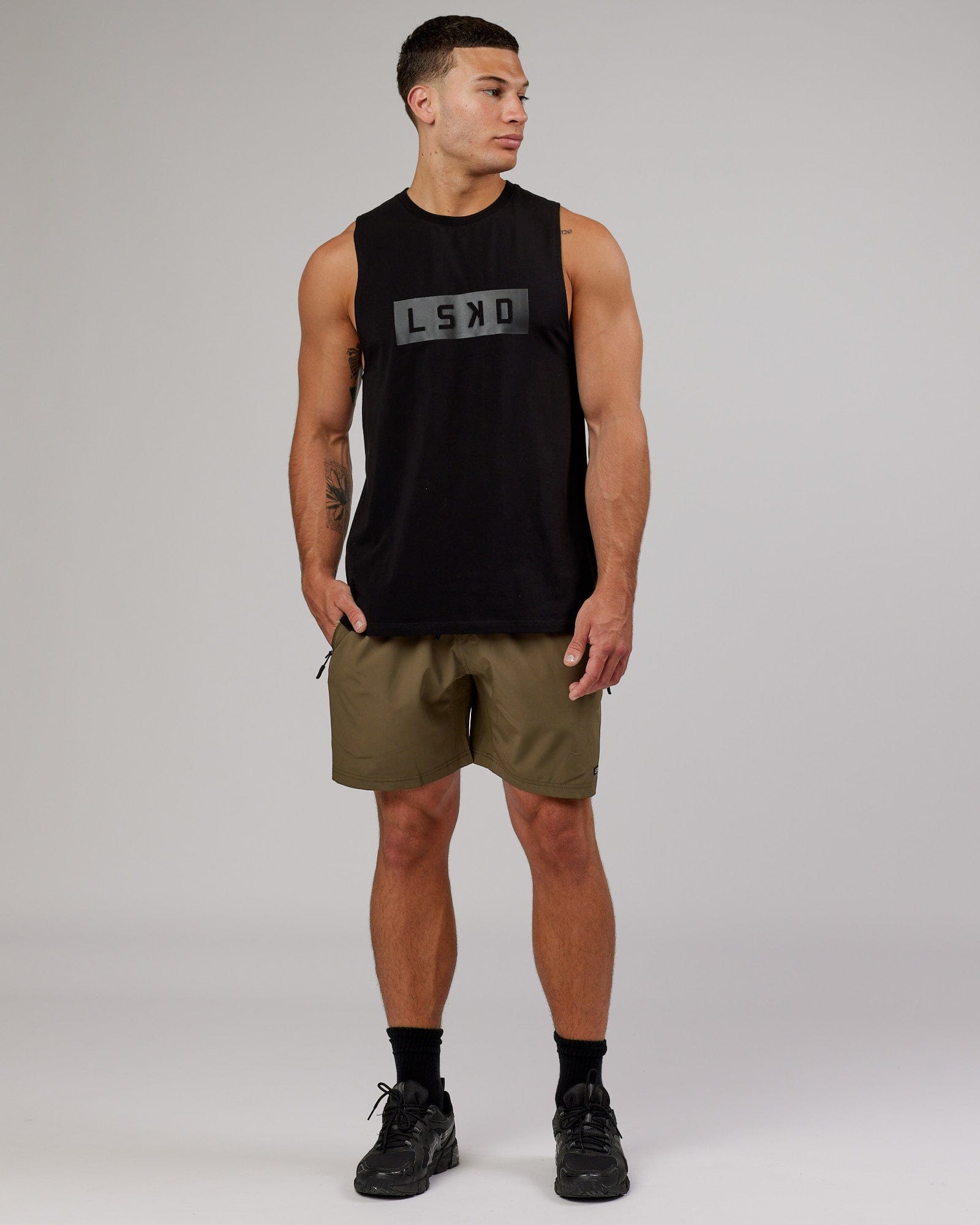 Model wearing Rep 7'' Performance Short - Army Green