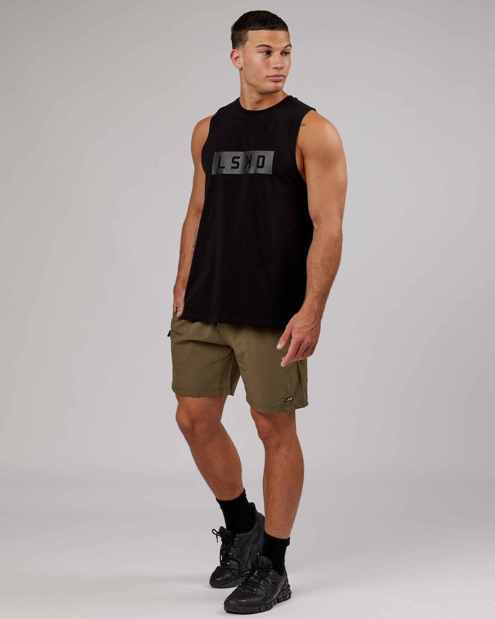 Model wearing Rep 7'' Performance Short - Army Green