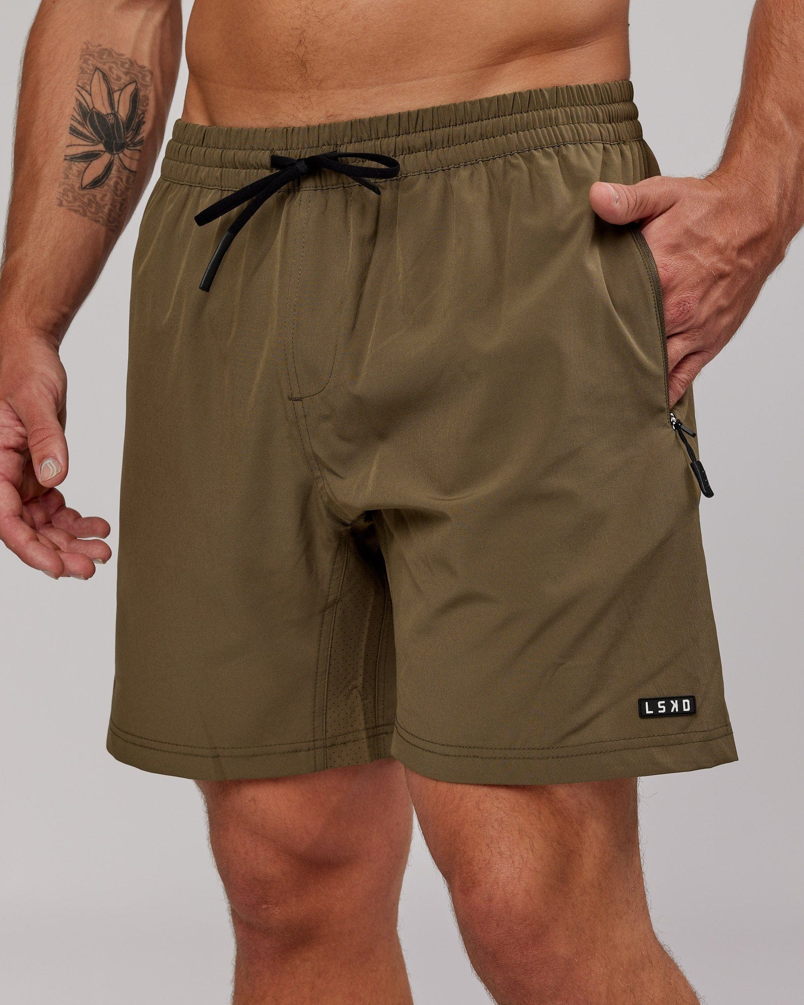 Model wearing Rep 7'' Performance Short - Army Green