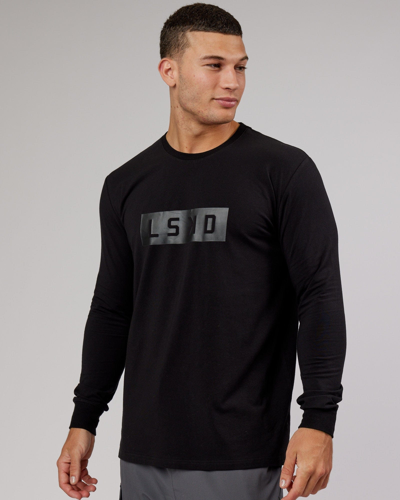Model wearing Strength FLXDRY Performance LS Tee - Black