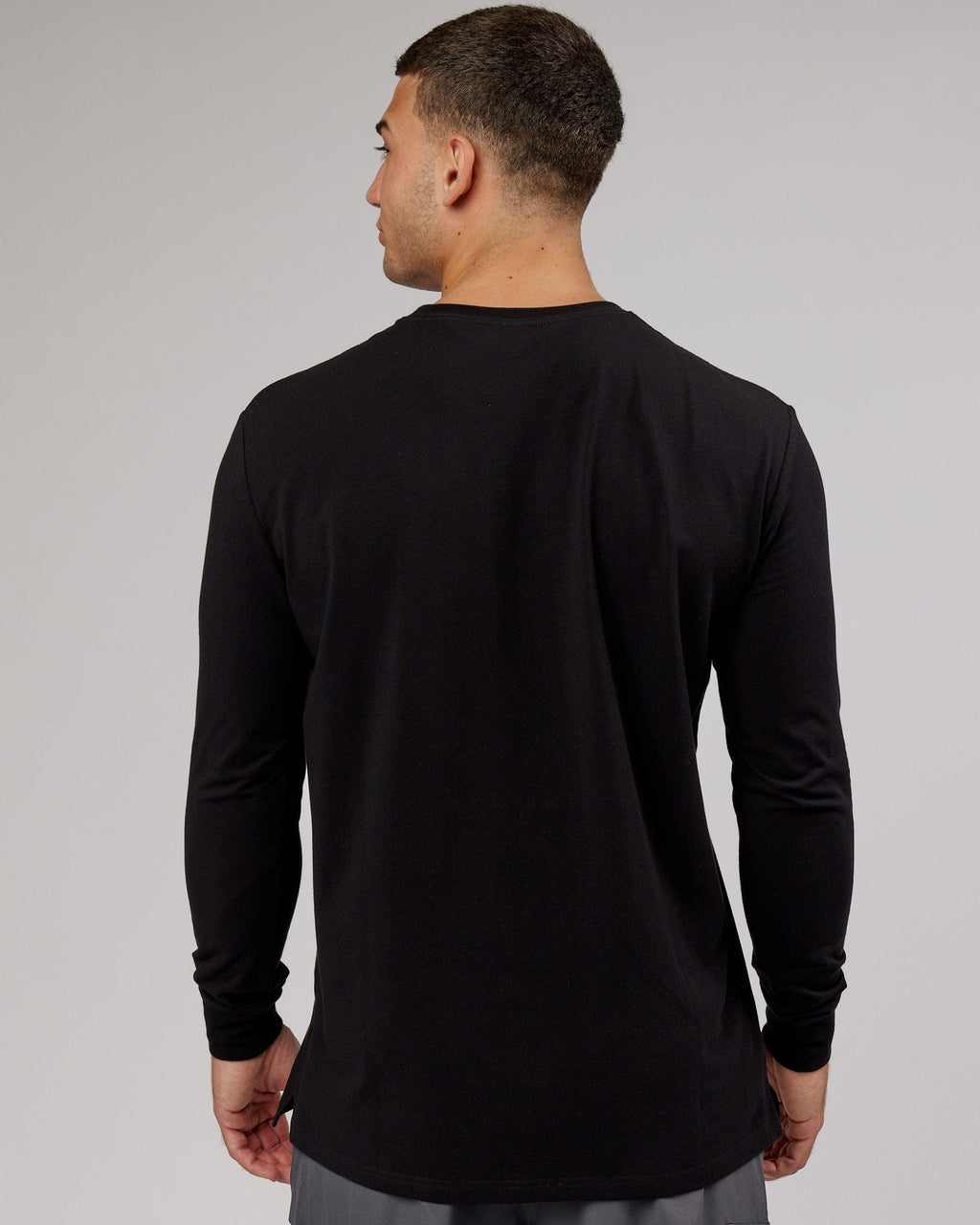 Model wearing Strength FLXDRY Performance LS Tee - Black