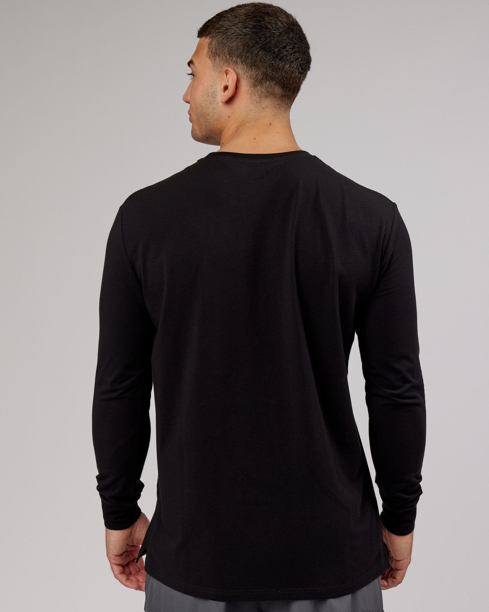 Model wearing Strength FLXDRY Performance LS Tee - Black