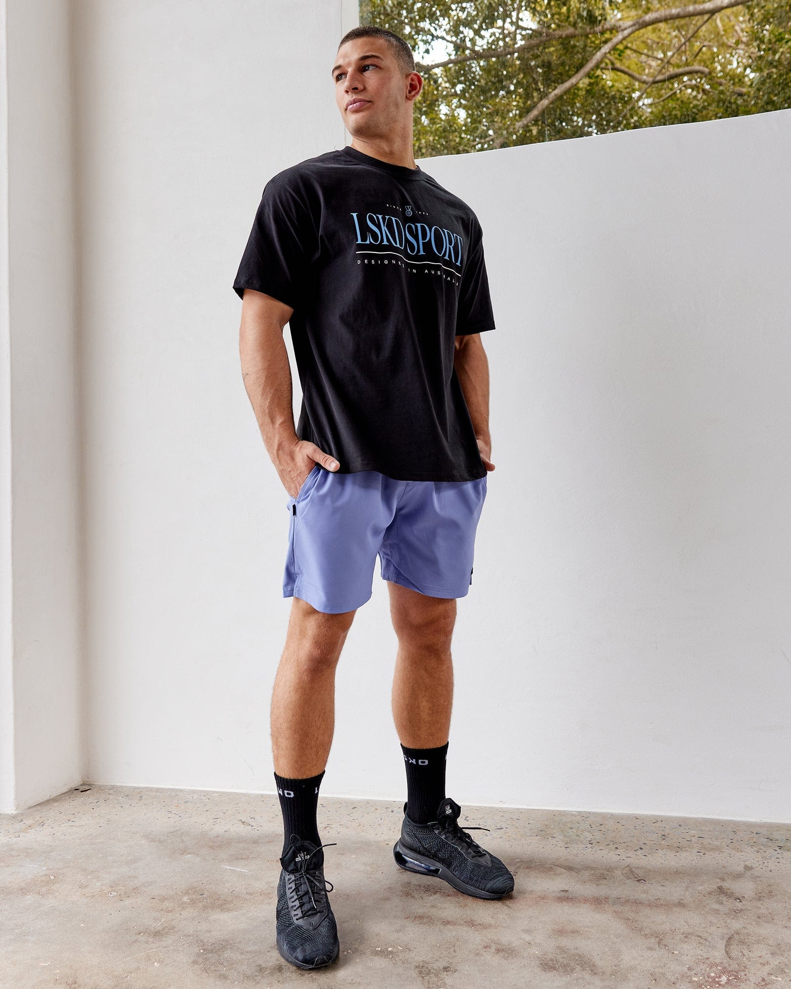 Model wearing Capsule 7" Performance Short - Cornflower Blue