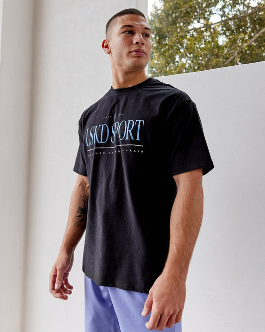 Model wearing Heritage Heavyweight Tee Oversize - Black-Cornflower Blue